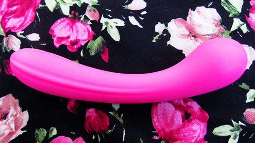 Image of the Lovehoney Satisfy Me G-Spot Dildo on a black and pink floral background