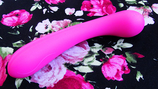 Image of the Lovehoney Satisfy Me G-Spot Dildo on a black and pink floral background
